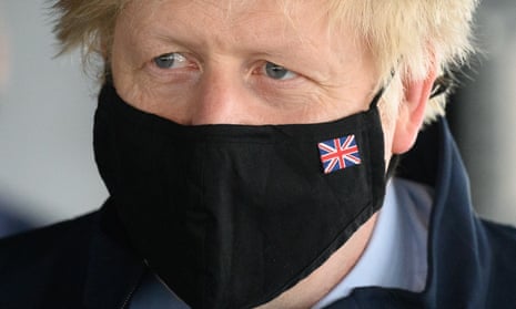 Boris Johnson wearing a union flag face mask