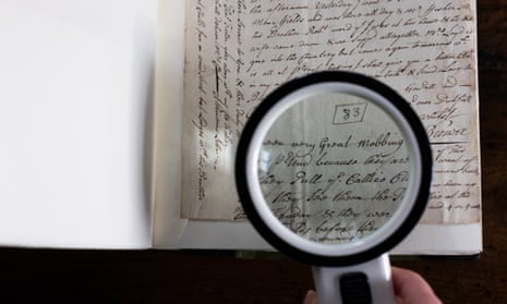 Magnifying glass held over one of the letters