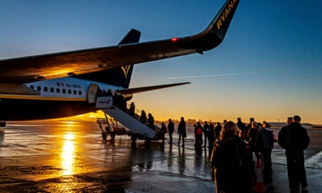 Passengers boarding a Ryanair flight to Dublin at sunrise. 