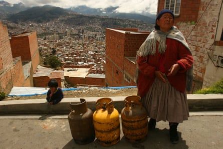 Owner of a small restaurant in the outskirts of La Paz waits to buy cooking gas in a street of the Bolivian capital.