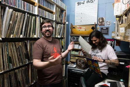 Former station managers Jack McDonald (left) and incoming station manager Nick Stephan flick through some well-worn vinyl in the record library.