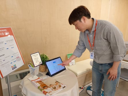 A man touches a touch screen computer