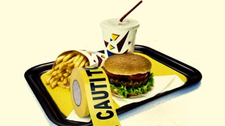 A tray pinch a burger, fries and a soft drink