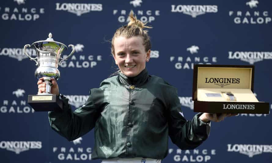 Hollie Doyle celebrates with her trophy after winning the French Oaks.