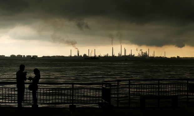 Storm clouds gather over Shell’s Pulau Bukom oil refinery in Singapore.