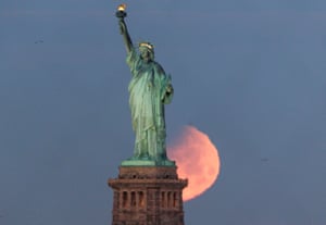 In frame behind the Statue of Liberty, New York, US