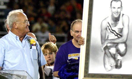 Bobby Joe Morrow (left) is handed an Olympic portrait of himself during the 2006 inauguration of the stadium that bears his name in San Benito, Texas.