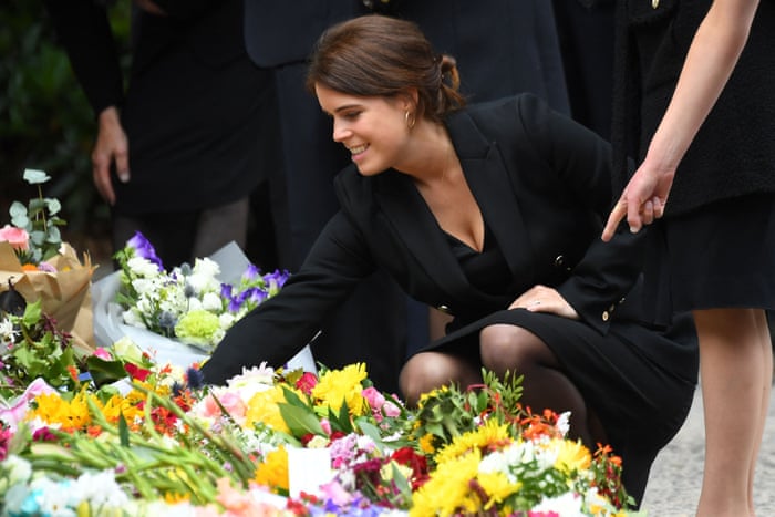 Princess Eugenie of York looks at the flowers outside Balmoral.