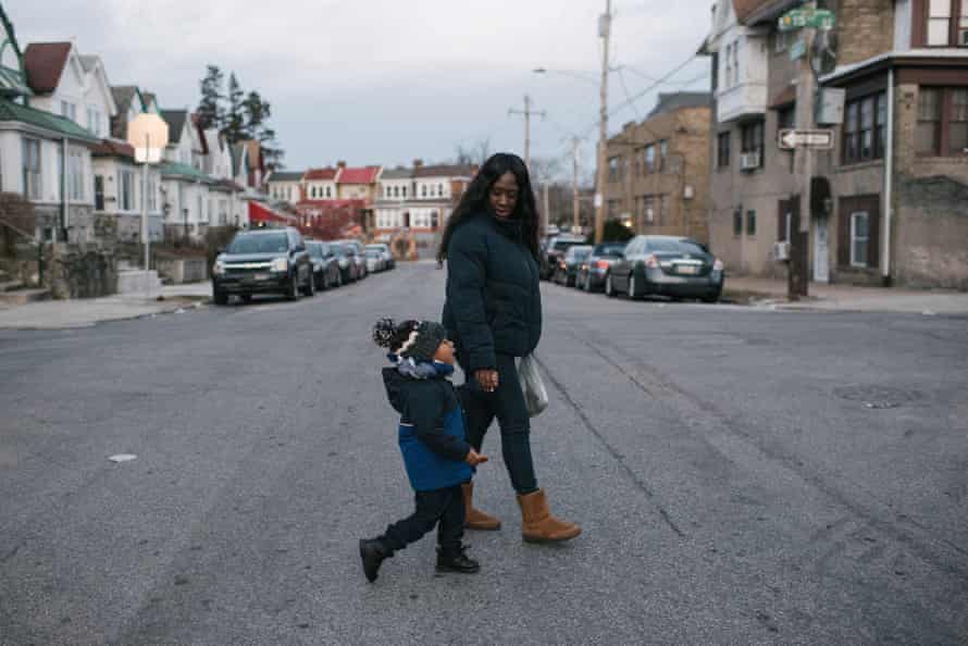 Shanaya Ball, 27, right, walks with her son, Amari Shuler, 2.5, her home in Philadelphia, PA. on Thursday, February 20, 2020.