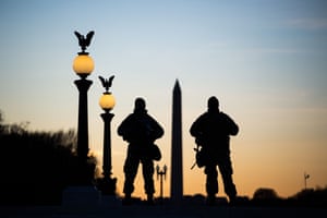 National Guard soldiers keep guard in front of the Capitol Building and near the Washington Monument