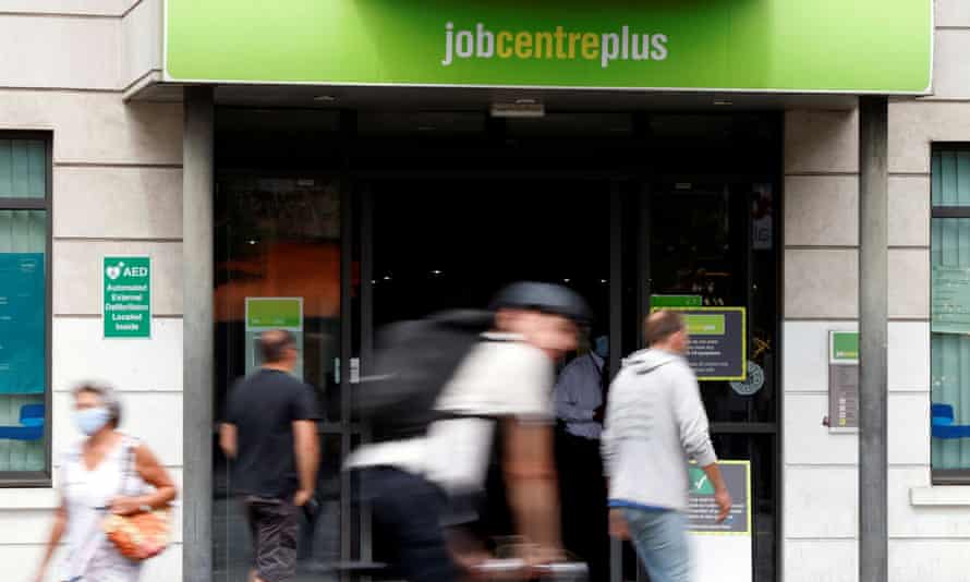 People walk past a branch of Jobcentre Plus