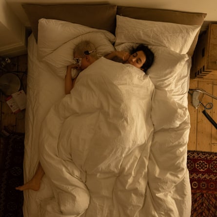 Frankie (on left of picture) and Divya in bed (time 00.00)