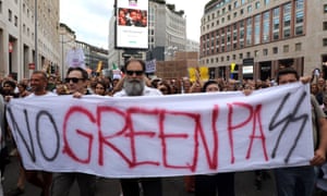 Demonstrators rally during a protest against the ‘Green Pass’ vaccine passport in the centre of Milan.