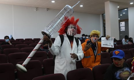 Clowns pose for a photo after getting their shots of the Sinopharm Covid-19 vaccine during a vaccination campaign targeting people between ages 18 and 30 at the public University San Andres in La Paz, Bolivia.