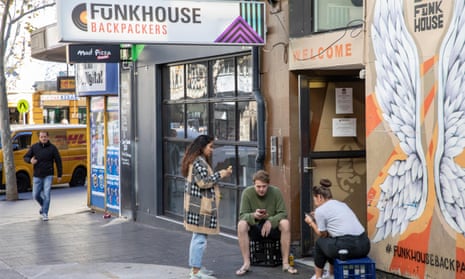 Backpackers outside a Sydney hostel in 2019. Hostel closures and an uptick in travel have driven up accomodation costs.