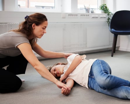 Teacher giving first aid training