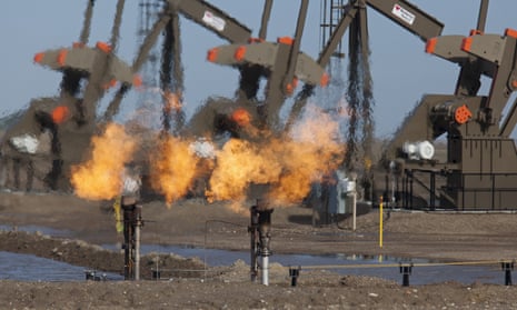 Natural gas is flared off as oil is pumped in the Bakken shale formation in North Dakota, US.