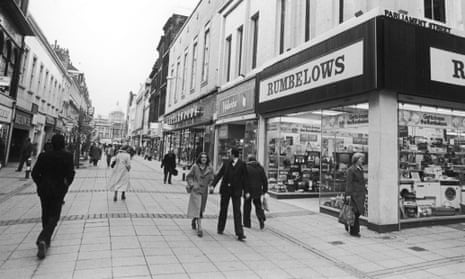 A 1970s shopping street with Rumbelows on the corner
