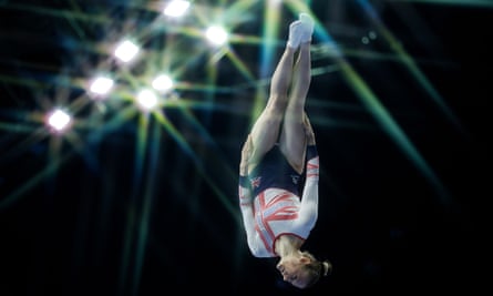 Bryony Page hangs upside down in the air during her trampoline performance in Birmingham