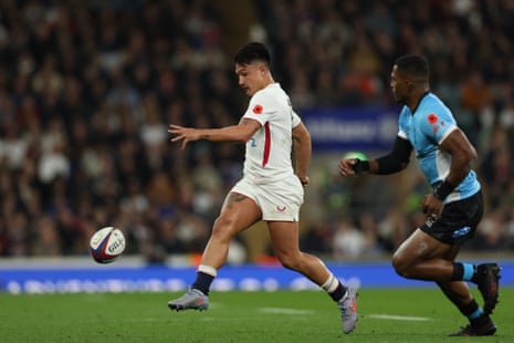 England's full-back Marcus Smith does a grubber kick to gain territory.