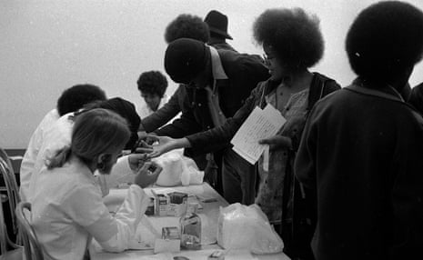 Bags of groceries are given away, and participants can also take sickle cell anemia tests and register to vote.