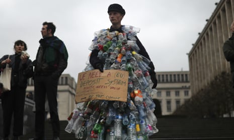 A man wears a costume of empty plastic bottles during a climate protest in Brussels, Friday, March 15, 2019. From the South Pacific to the edge of the Arctic Circle, students mobilized by word of mouth and social media skipped class Friday to protest what they believe are their governments’ failure to take though action against global warming.