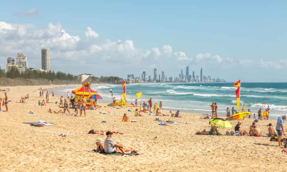 High rise apartment buildings at Surfers Paradise with Burleigh head beach in the foreground, Gold Coast, Queensland, Australia