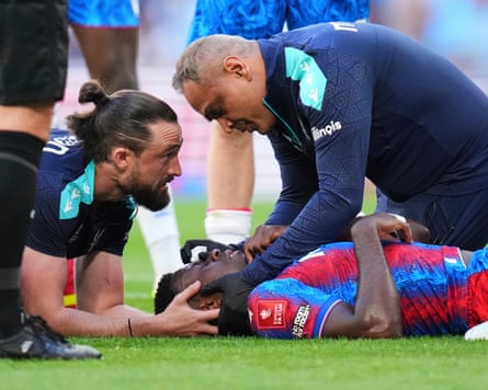 Marc Guéhi is treated for the eye injury that saw him replaced in the second half of the FA Cup final