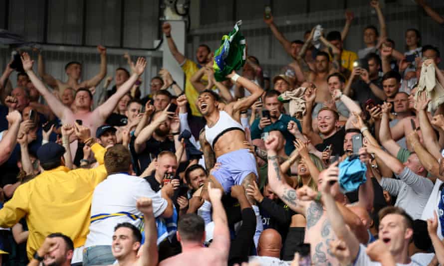 Raphinha celebrates with the away fans after Leeds beat the drop at Brentford.