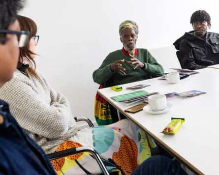 People sitting around a meeting table