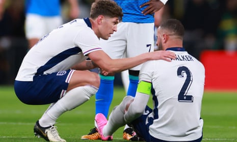John Stones with the injured Kyle Walker  during the international friendly match between England and Brazil