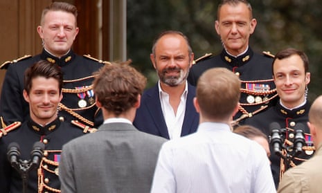 Philippe poses with French Republican Guards before the official handover ceremony.
