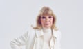 Head and shoulders shot of actor Susan Hampshire in cream jumper and jacket against grey background