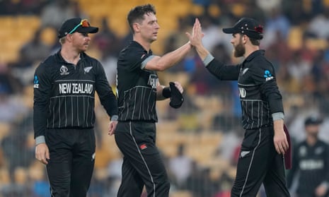 New Zealand's Matt Henry (centre) celebrates the wicket of Bangladesh's Mustafizur Rahman with his teammates.