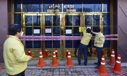 Government officials close down a branch of the Shincheonji Church of Jesus in Gwangju, South Korea