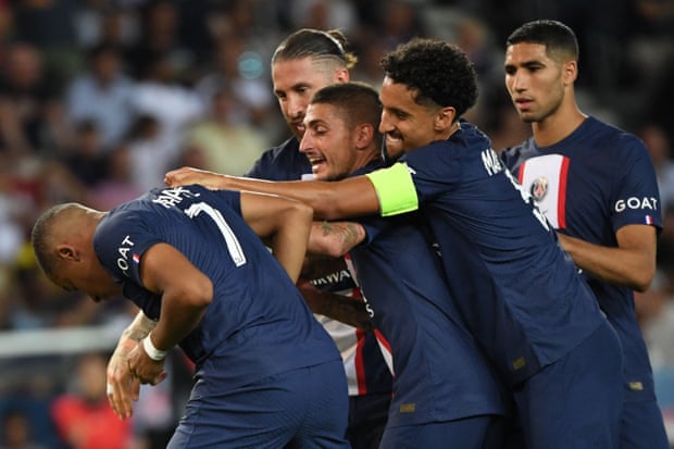 Paris Saint-Germain players celebrate with Kylian Mbappe (left) after he scored their fourth goal against Montpellier.