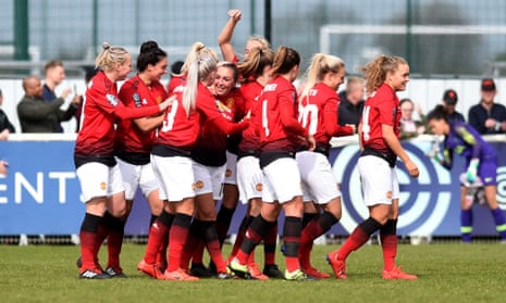 Teammates congratulate Katie Zelem after her goal for Manchester United.