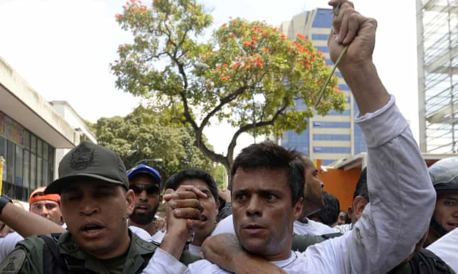 Leopoldo López is escorted by the national guard after turning himself in during a demonstration in Caracas on 18 February 2014.