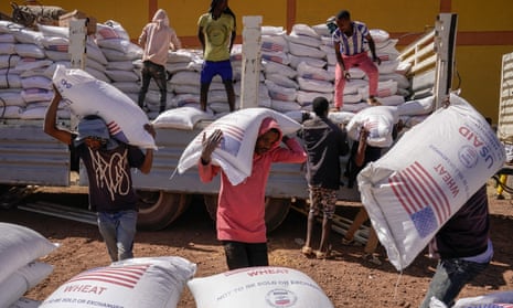 Volunteers at the Zanzalima camp for internally displaced people in Bahir Dar, Ethiopia unloading an aid delivery from USAid on 17 December.