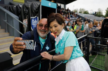 Michele Kang, the owner of London City Lionesses, meets a supporter before kick-off.