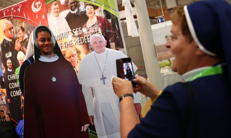 A nun snaps her friend next to a cardboard cut-out of the pope at last year’s World Congress of Families in Dublin.