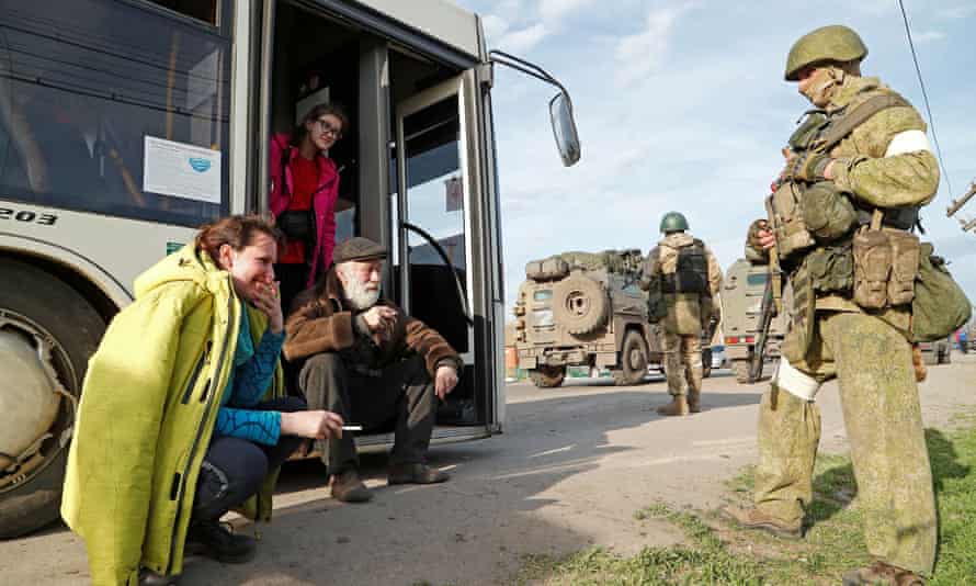 Azovstal steel plant employee Natalia Usmanova (L), 37, who was evacuated from Mariupol, is seen along with other evacuees near a temporary accommodation centre in the village of Bezimenne in the Donetsk Region, Ukraine May 1, 2022. REUTERS/Alexander Ermochenko