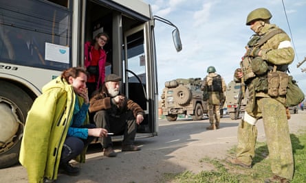 Natalia Usmanova with other evacuees near a temporary accommodation centre the village of Bezimenne in Donetsk.