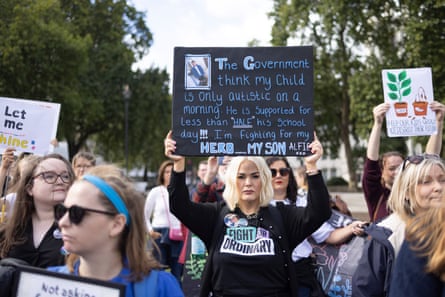 'the government think my child is only autistic on a morning. He is supported for less than half his school day. I'm fighting for my hero. My son Alfie'. She has blond hair and is wearing a black T-shirt with the slogan 'fight for ordinary'.