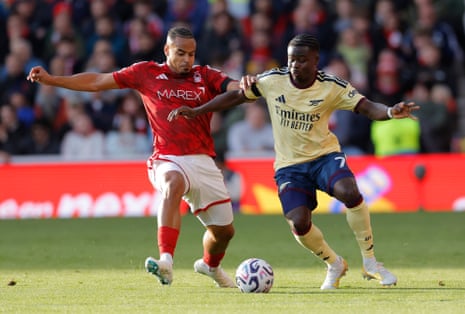 Bukayo Saka (right) challenges Murillo