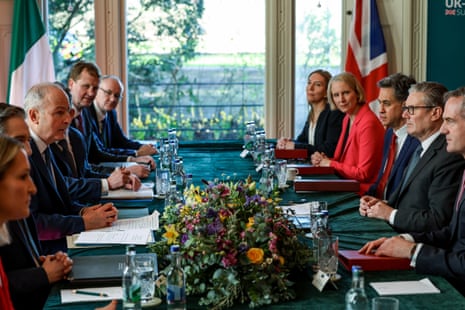 Starmer sat on a table with nine other officials during a meeting.