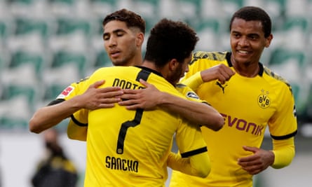 Achraf Hakimi celebrates with Jadon Sancho and Manuel Akanji after doubling Dortmund’s lead