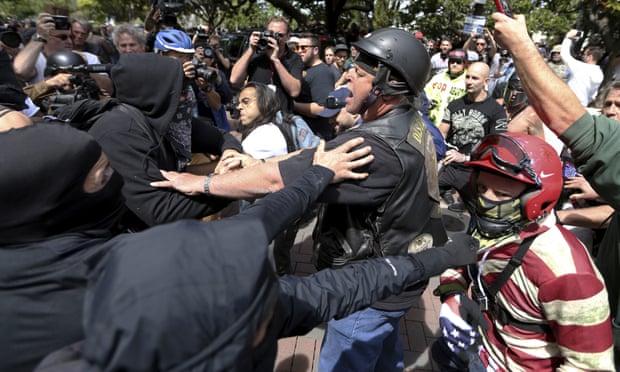 Anti and pro-Donald Trump supporters clash at Martin Luther King Jr Civic Center Park in Berkeley, California on Saturday.