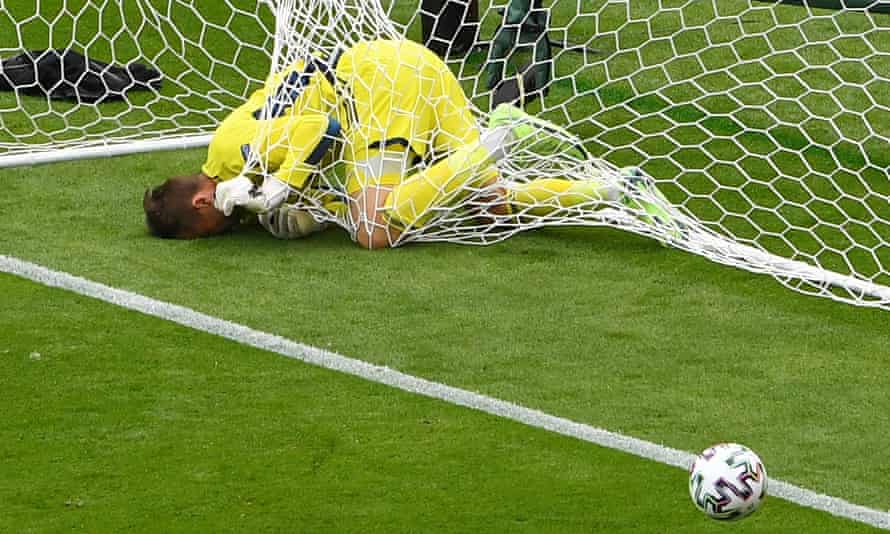 Scotland goalkeeper David Marshall lies in the net after being hit from a way too long by Patrick Schick.