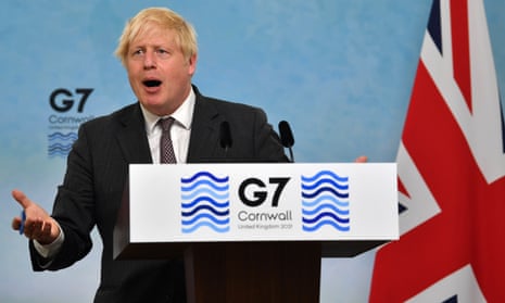 Boris Johnson gestures during a press conference on the final day of the G7 summit